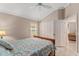 Bedroom with wood-look tile flooring, a ceiling fan, and a closet at 3342 Queensway Ter, The Villages, FL 32163