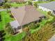 Aerial view of a home with manicured landscaping and a backyard perfect for outdoor living and entertaining at 3654 Enterprise Dr, The Villages, FL 32163