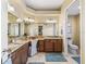Bathroom boasts granite counters, dual sinks, vanity area, and separate toilet room at 3654 Enterprise Dr, The Villages, FL 32163