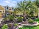 Professionally landscaped front yard with mature palms adds curb appeal to this home at 3654 Enterprise Dr, The Villages, FL 32163