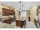 Modern kitchen featuring stainless steel appliances, granite countertops, and a breakfast bar at 3654 Enterprise Dr, The Villages, FL 32163