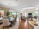 Open concept living room with tray ceilings, hardwood floors and decorative furnishings at 3654 Enterprise Dr, The Villages, FL 32163