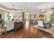 Open floor plan that features a smooth transition from the living room into the kitchen and dining areas at 3654 Enterprise Dr, The Villages, FL 32163
