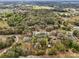 A stunning aerial view showcasing the property nestled within a landscape of lush trees at 36816 Taylor Mill Rd, Fruitland Park, FL 34731