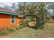 Backyard with arbor featuring lush landscaping and natural light at 36816 Taylor Mill Rd, Fruitland Park, FL 34731