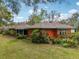 Expansive backyard featuring lush green grass, mature trees, and privacy at 36816 Taylor Mill Rd, Fruitland Park, FL 34731