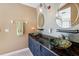Stylish bathroom featuring unique vessel sinks and granite countertop at 36816 Taylor Mill Rd, Fruitland Park, FL 34731