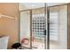 Modern bathroom with glass shower and a block window feature at 36816 Taylor Mill Rd, Fruitland Park, FL 34731