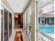 Hallway with view of pool area and connecting access to the kitchen at 36816 Taylor Mill Rd, Fruitland Park, FL 34731