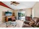 Cozy living room with a decorative ceiling and sliding glass doors to the outdoor living space at 36816 Taylor Mill Rd, Fruitland Park, FL 34731