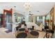 Open-concept living and kitchen area with bright lighting, modern decor, seamless design, and comfortable seating at 36816 Taylor Mill Rd, Fruitland Park, FL 34731