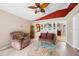 Living room with red ceiling accent and adjacent rooms visible in the background at 36816 Taylor Mill Rd, Fruitland Park, FL 34731