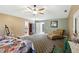 Open main bedroom with sitting area, ceiling fan and neutral tones to allow for multiple decor options at 36816 Taylor Mill Rd, Fruitland Park, FL 34731