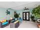 Inviting patio with comfortable seating, ceiling fan, and stylish décor at 36816 Taylor Mill Rd, Fruitland Park, FL 34731