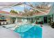 Backyard pool area featuring a screened enclosure and ample space for outdoor enjoyment at 36816 Taylor Mill Rd, Fruitland Park, FL 34731