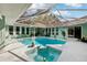 Beautifully designed pool area with screened enclosure and well-maintained landscaping at 36816 Taylor Mill Rd, Fruitland Park, FL 34731