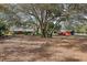Large property featuring mature trees, two outbuildings, and the main home at 36816 Taylor Mill Rd, Fruitland Park, FL 34731