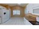 Kitchen featuring an eat in kitchen table, white cabinets, granite countertops, and white appliances at 3824 Doune Way, Clermont, FL 34711