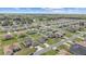 Expansive aerial view of the neighborhood, featuring green landscapes and quiet streets at 4000 Se 98Th Pl, Belleview, FL 34420