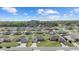 Aerial view of a neighborhood showcasing manicured lawns and tree lined streets at 4000 Se 98Th Pl, Belleview, FL 34420