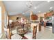 Open dining area with seating for four, view to the kitchen and living room at 4000 Se 98Th Pl, Belleview, FL 34420