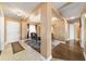 Spacious dining room featuring a statement chandelier, modern furniture, and elegant finishes at 4000 Se 98Th Pl, Belleview, FL 34420