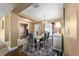 Inviting dining room boasts a modern chandelier, stylish furniture, and decor for memorable gatherings at 4000 Se 98Th Pl, Belleview, FL 34420