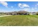 Single-story home with a well-maintained lawn and a two-car attached garage at 4000 Se 98Th Pl, Belleview, FL 34420