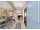 Inviting home interior with a formal dining area, entryway, and a glimpse into the living room at 4000 Se 98Th Pl, Belleview, FL 34420