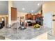 Modern kitchen featuring granite countertops, stainless steel appliances, and ample cabinet space at 4000 Se 98Th Pl, Belleview, FL 34420