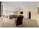 Inviting living room with comfortable seating, a television, and neutral decor at 4000 Se 98Th Pl, Belleview, FL 34420