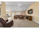 Spacious living room featuring a comfortable seating area and a view of the outdoor landscape at 4000 Se 98Th Pl, Belleview, FL 34420