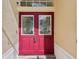 Elegant double front doors with decorative glass panels and secure entry, offering a warm welcome at 5135 Aurora Dr, Leesburg, FL 34748