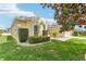 Well maintained yard surrounding a charming single-story home featuring manicured landscaping at 5135 Aurora Dr, Leesburg, FL 34748