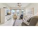 Bright living room featuring tile floors, comfortable seating, and large windows offering natural light at 5135 Aurora Dr, Leesburg, FL 34748