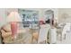 Cozy living room with natural light, comfortable seating, and views of the lanai at 5135 Aurora Dr, Leesburg, FL 34748