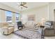 Spacious living room with tile floors, comfortable seating, and large windows for ample natural light at 5135 Aurora Dr, Leesburg, FL 34748