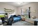 Bedroom with decor, computer setup, and a metal bed frame by the window at 5466 Compass Pt # 101, Oxford, FL 34484