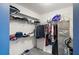 This walk-in closet is well-stocked with clothes and shelving at 5466 Compass Pt # 101, Oxford, FL 34484