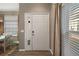 Welcoming entryway featuring a door with side windows and natural light at 5466 Compass Pt # 101, Oxford, FL 34484