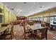 An elegant event space with tables, chairs, chandeliers, and large windows in a community center at 5466 Compass Pt # 101, Oxford, FL 34484