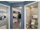 This hallway shows access to the bedroom, the walk-in closet with shelves, and a water closet at 5466 Compass Pt # 101, Oxford, FL 34484
