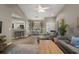 Bright open floor plan with living and dining spaces and a kitchen bar, perfect for entertaining at 5466 Compass Pt # 101, Oxford, FL 34484