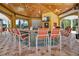 Outdoor bar with seating, a TV, and stylish decor in a residential community space at 5466 Compass Pt # 101, Oxford, FL 34484