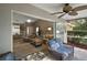 Spacious screened porch transitioning to the living area, dining room, and backyard at 5466 Compass Pt # 101, Oxford, FL 34484