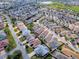Aerial view of a residential community with a property outlined in red at 591 Statesburg St, The Villages, FL 32162