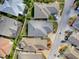 Aerial view of the property showcasing the roof, landscaping, and surrounding neighborhood at 591 Statesburg St, The Villages, FL 32162