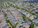 An aerial view shows the community with well-maintained houses and landscaping, highlighting the property's location at 591 Statesburg St, The Villages, FL 32162