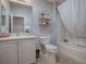 Clean bathroom offers a shower-tub combination and ample vanity space at 591 Statesburg St, The Villages, FL 32162