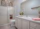 Well-maintained bathroom featuring a shower-tub combo and a vanity with ample counter space at 591 Statesburg St, The Villages, FL 32162